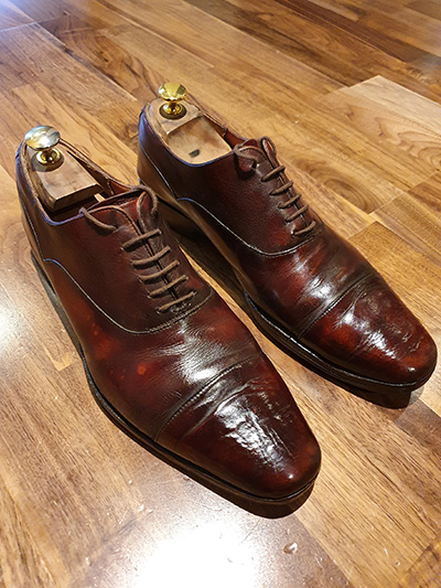 Pair of restored brown Shipton & Heneage shoes after a shoeshine
